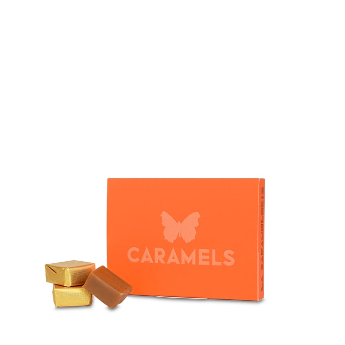 Caramels à l'Huile d'Olive Aromatisés à l'Orange Bigarade - 95g Boite en carton orange accompagnée de caramels 