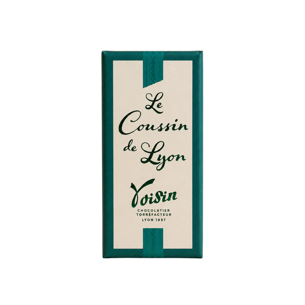 Boîte de Coussin de Lyon Voisin, spécialité chocolatée lyonnaise, emballage vert et blanc sur fond clair.