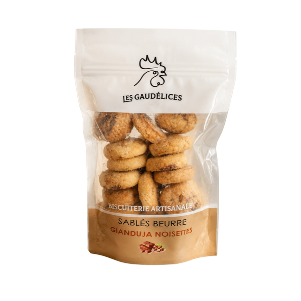 Sablés au beurre fourrés gianduja noisettes, biscuits artisanaux en sachet transparent Les Gaudélices.
