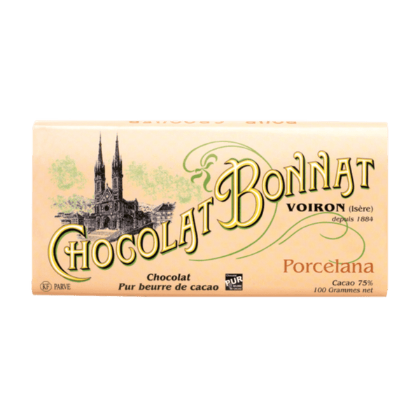 Tablette de chocolat noir Bonnat Porcelana 75 % cacao. L'emballage est beige, avec "Chocolat Bonnat" écrit en grande typographie dorée et verte au centre. Une illustration en noir d'une cathédrale est située sur la gauche. À droite, des mentions en petits caractères précisent l’origine Porcelana et le pourcentage de cacao 75%.