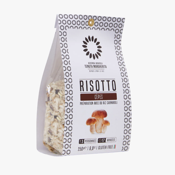 Préparation pour risotto aux cèpes au riz Carnaroli, sachet transparent et blanc, morceaux de champignons visibles, sans gluten.