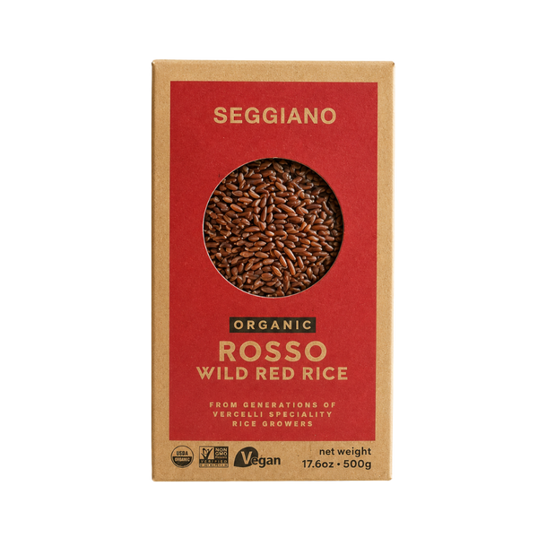 Riz rouge sauvage biologique Seggiano en boîte kraft, grains rouges visibles à travers fenêtre ronde.