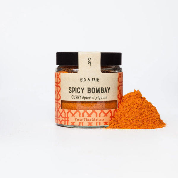Pot d’épices bio Spicy Bombay SoulSpice, curry orange épicé et piquant avec couvercle noir.