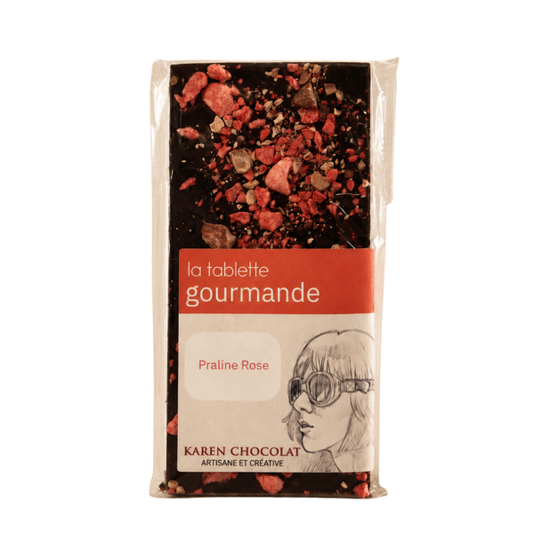 Tablette gourmande à la praline rose sur fond blanc.