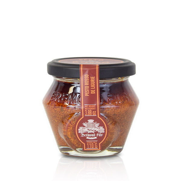 Pesto rosso de Ligurie Brémond Fils en pot en verre, sauce rouge aux tomates séchées sur fond neutre.