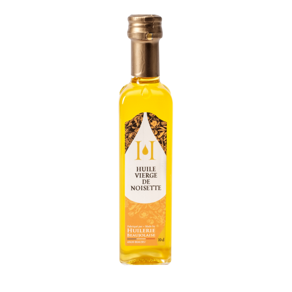 Huile vierge de noisette, produite par l'Huilerie Beaujolaise selon une méthode traditionnelle.  Bouteille de 10 cl.